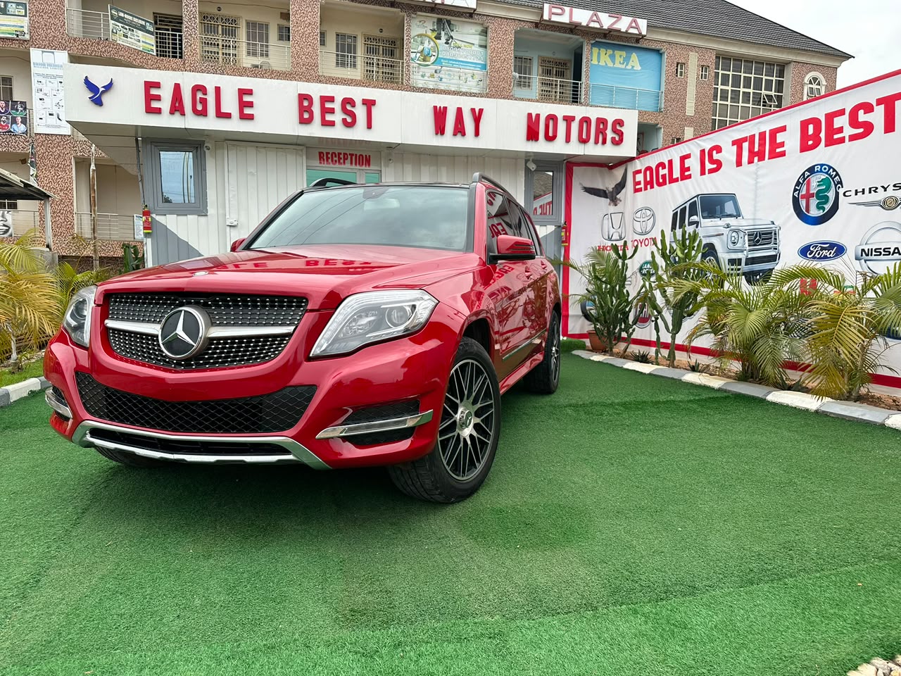 Red Mercedes-Benz vehicle at Eagle Best Way Motors showroom